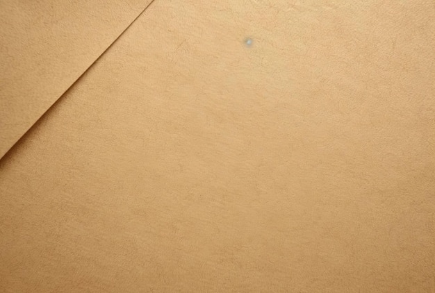 una fotografia ravvicinata di uno sfondo di carta colorata beige