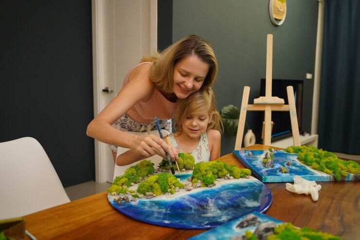 Una madre e sua figlia creano paesaggi naturali vivaci