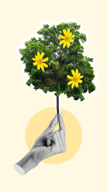 Una mano umana che tiene un albero verde