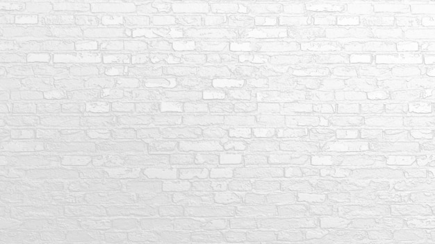 una parete di mattoni bianchi con un muro di mattoni sullo sfondo