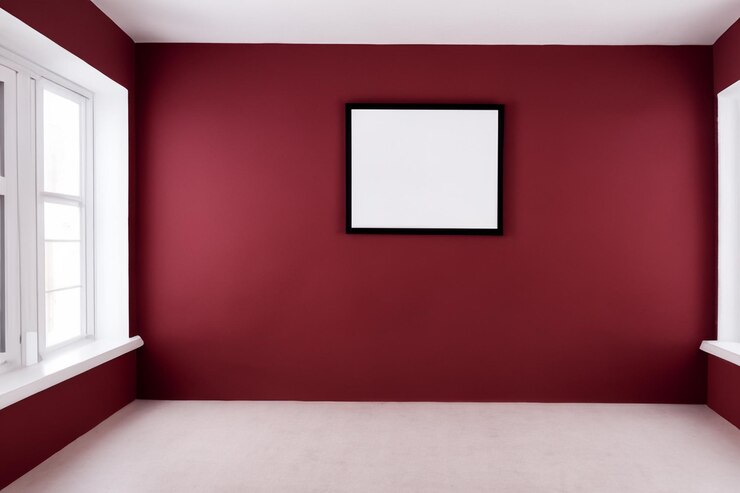 una parete rossa con una foto di una stanza con una parete rossa e una cornice per immagini