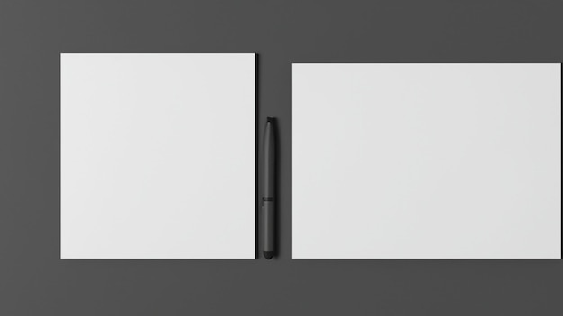 Una penna nera è accanto a un taccuino bianco.