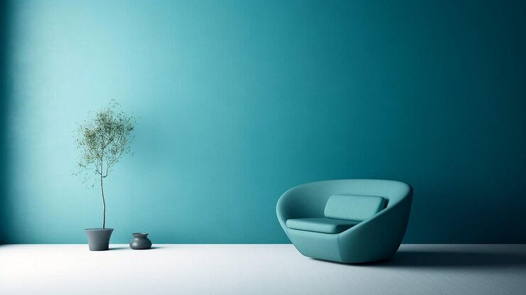 Una sedia blu in una stanza con accanto una pianta