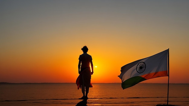 Una silhouette di una persona in piedi di fronte a un bellissimo tramonto