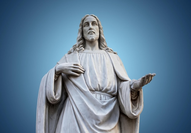 Una statua di Gesù con le mani aperte