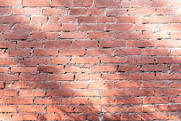 Una trama di un vecchio muro di mattoni rossi di un buildong