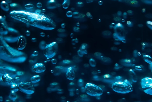 Uno sfondo blu con bolle e la parola bolla su di esso