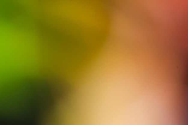 Uno sfondo colorato con uno sfondo verde e uno sfondo sfocato con uno sfondo giallo e arancione.