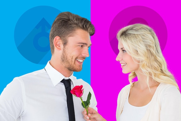 Uomo bello che sorride alla ragazza che tiene una rosa contro il simbolo del genere femminile