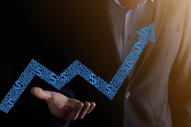 Uomo d'affari che tiene un grafico con una crescita positiva dei profitti. pianificare la crescita del grafico e l'aumento degli indicatori positivi del grafico nella sua attività. più redditizia e in crescita.