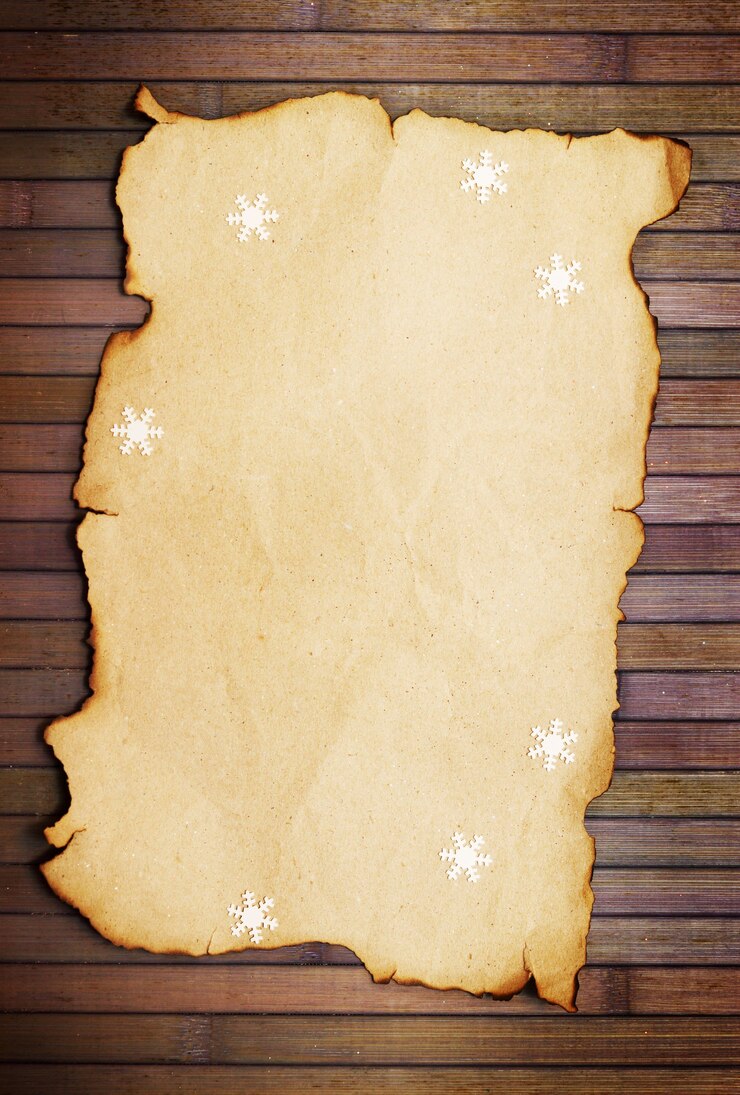 Foto vecchia carta vuota bruciata e fiocchi di neve decorativi