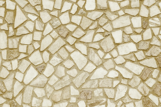 Vecchia struttura beige della parete del mosaico