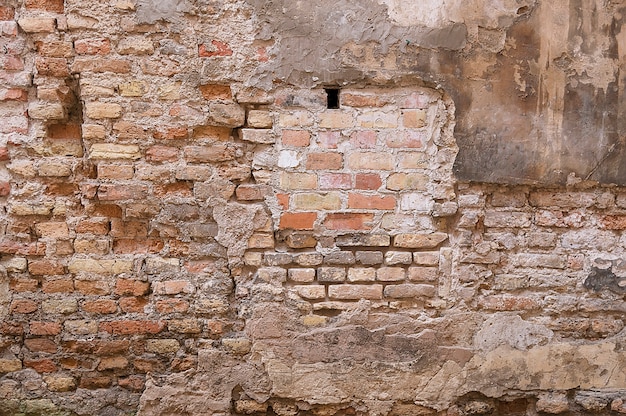 Vecchia struttura del fondo del muro di mattoni rosso