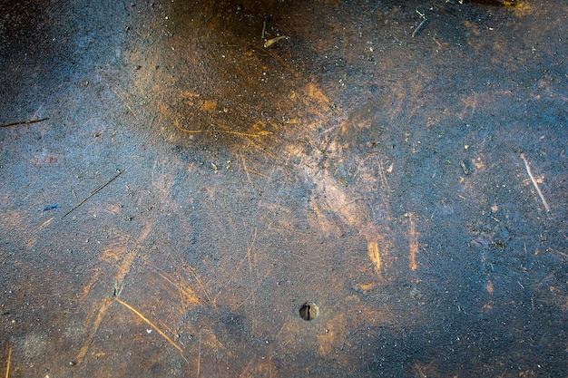 Vecchia struttura di legno di lerciume macchiata di olio