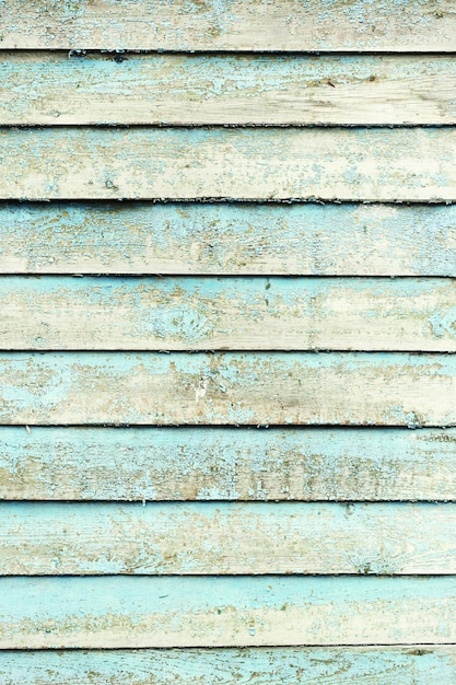Vecchia superficie in legno colorato con crepe