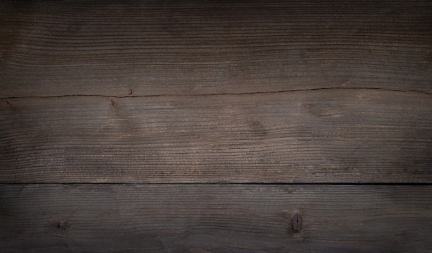 Vecchia tavola di legno scuro con strisce orizzontali