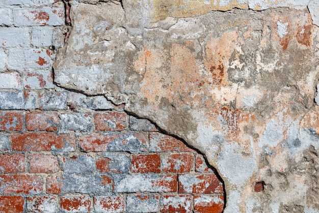 Vecchio fondo del muro di mattoni per la struttura di pietra di progettazione