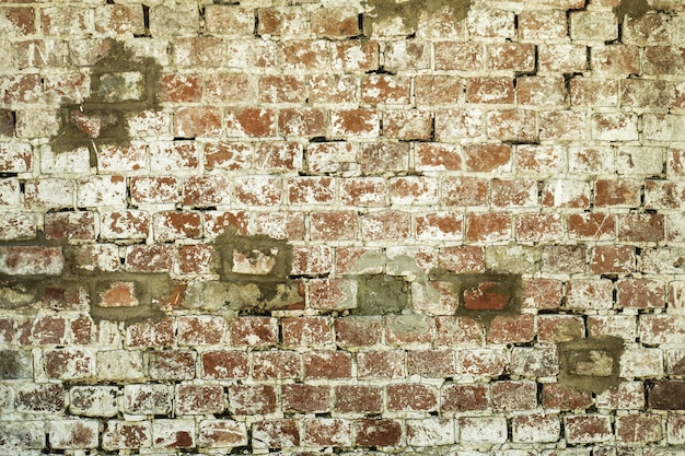 Vecchio fondo di struttura della parete del mattone rosso e bianco