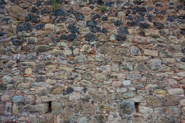 Vecchio fondo di struttura della parete di pietra