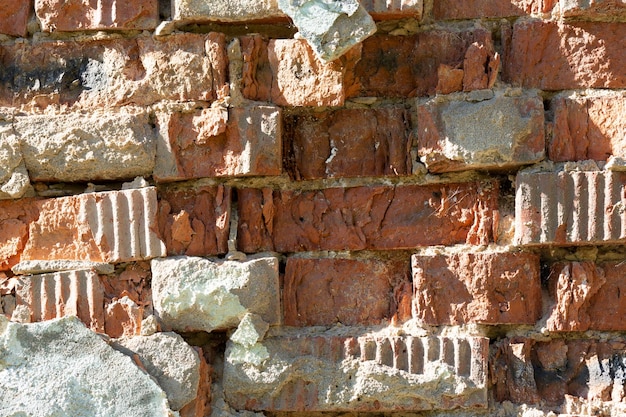 Vecchio fondo indossato rosso di struttura del muro di mattoni