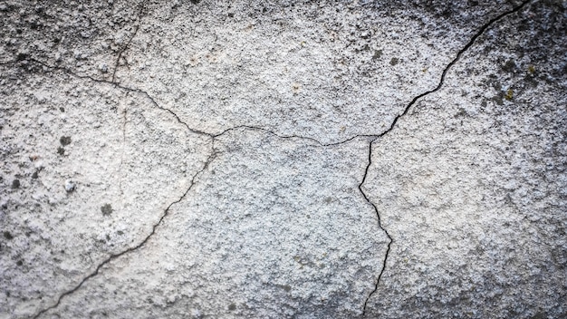 Vecchio muro di pietra con una crepa. trama per il design