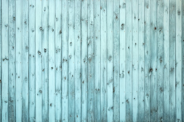 Vecchio primo piano blu del recinto di legno