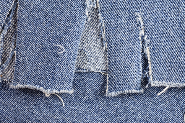 Vecchio sfondo di jeans blu.