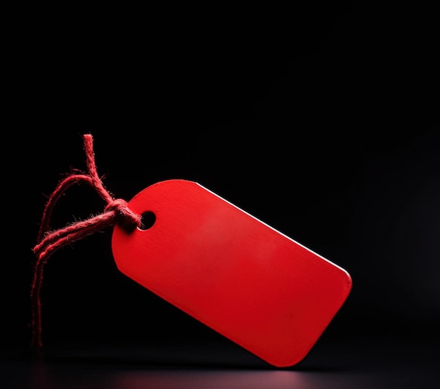 Venerdì nero Adesivo rosso da cartellino del prezzo su un laccio su sfondo nero Generato dall'intelligenza artificiale