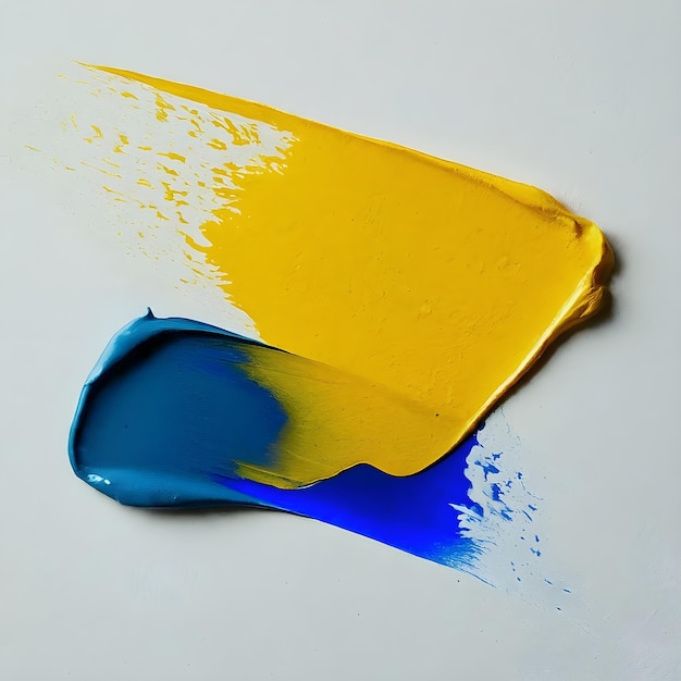 Vibranti tratti di pittura ad olio giallo e blu su uno sfondo bianco