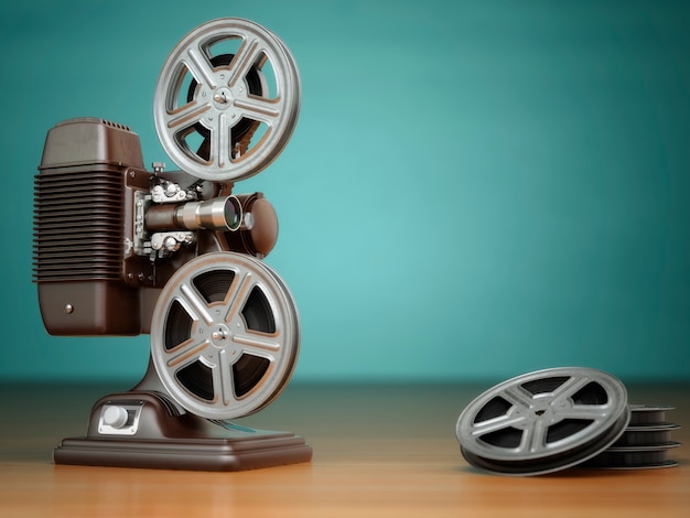 Video, concetto di cinema. Proiettore cinematografico vintage e bobine su sfondo verde. 3d