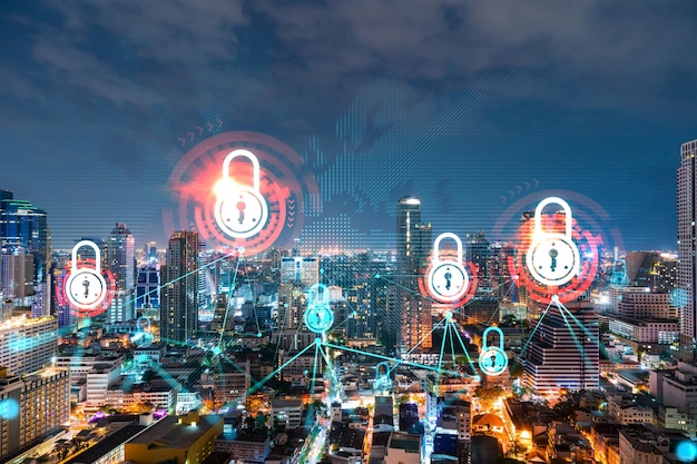 Vista panoramica notturna della città dell'ologramma del lucchetto luminoso di Bangkok in Asia Il concetto di sicurezza informatica per proteggere le aziende Doppia esposizione