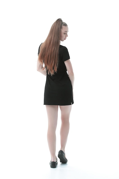 Vista posteriorebeautiful modello donna in abito nero corto isolato su bianco
