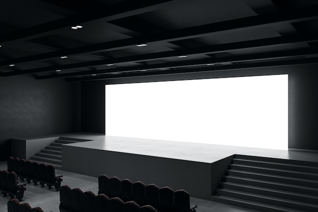 Vista prospettica su grande schermo bianco illuminato bianco con posto per il tuo testo o logo in un'enorme sala vuota con scale di scena e file di sedili Rendering 3D mock up