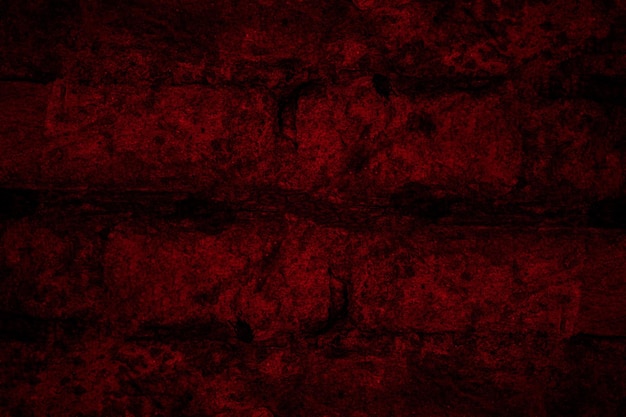 Vista ravvicinata del muro di mattoni rosso lunatico scuro per lo sfondo della trama