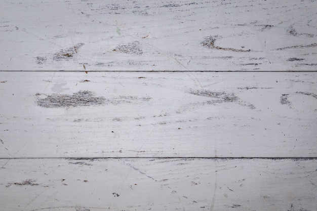 Vista superiore dei precedenti di legno bianchi della superficie della tavola.