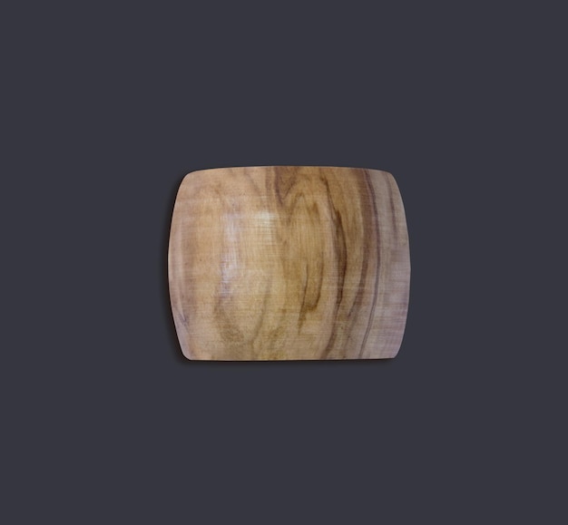 Visto dall'alto anello di tovagliolo in legno d'oliva isolato su uno sfondo scuro adatto al tuo elemento di design