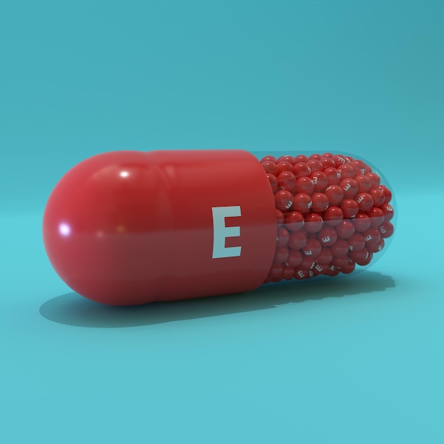 Vitamina E con granuli di capsule rosse e sfondo turchese