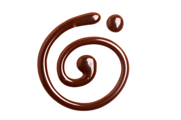 Vortice di salsa al caramello al cioccolato su un semplice dorso bianco