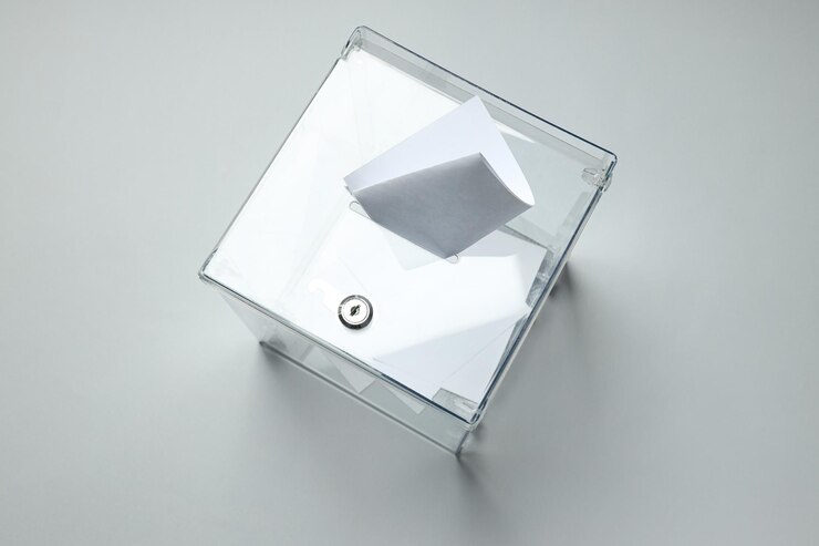 Photo voting box with papers on gray background top view