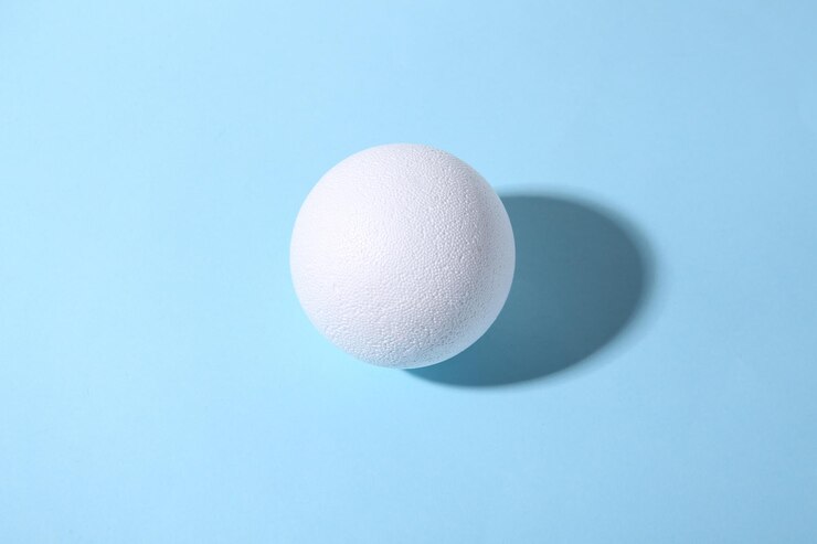 White ball on a blue background with a shadow Minimalism