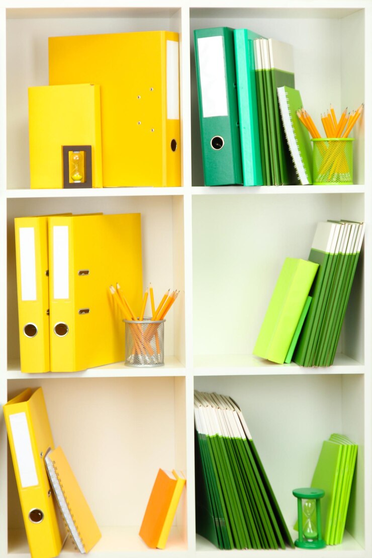Photo white office shelves with different stationery close up