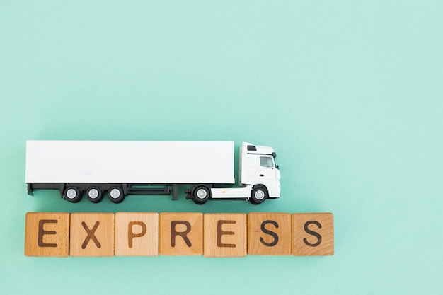 White truck with wooden box on turquoise background Express delivery