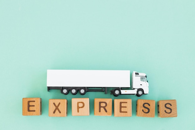 White truck with wooden box on turquoise background Express delivery