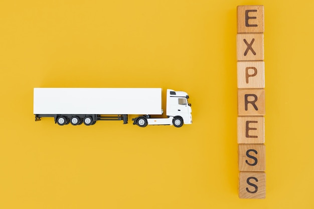White truck with wooden box on yellow background Express delivery