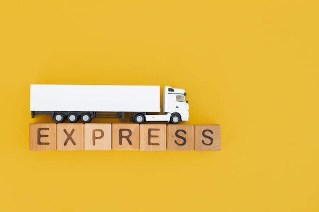 White truck with wooden box on yellow background Express delivery