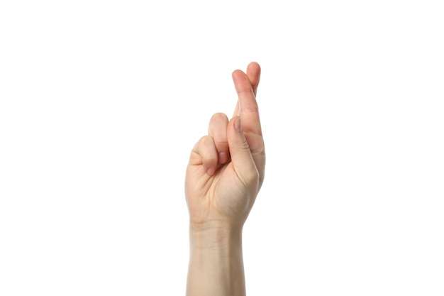Woman hand with crossed fingers isolated on white surface