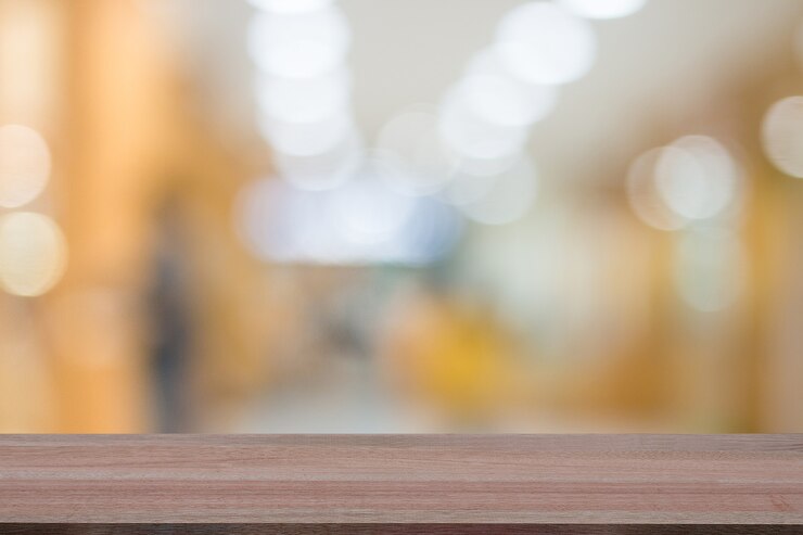 Wood table top on blur hospital interior background