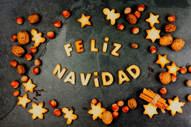 Words Merry Christmas en Spanish with cookies cookies,