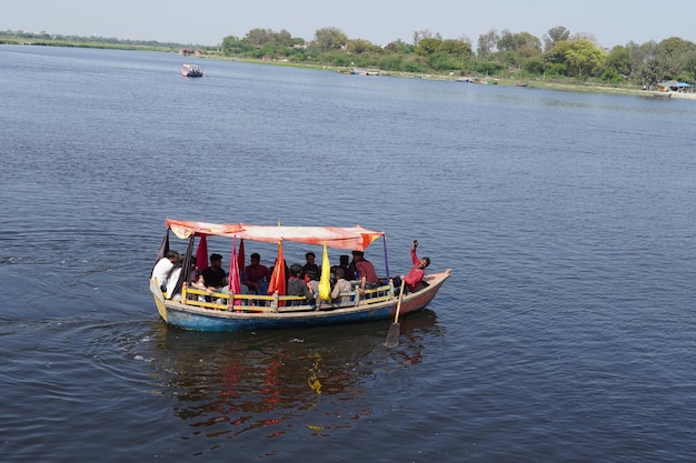 Yamuna river vrindavan people riding an a boat in the pond image 08March2023 Vrindavan Uttar Pradesh 281121
