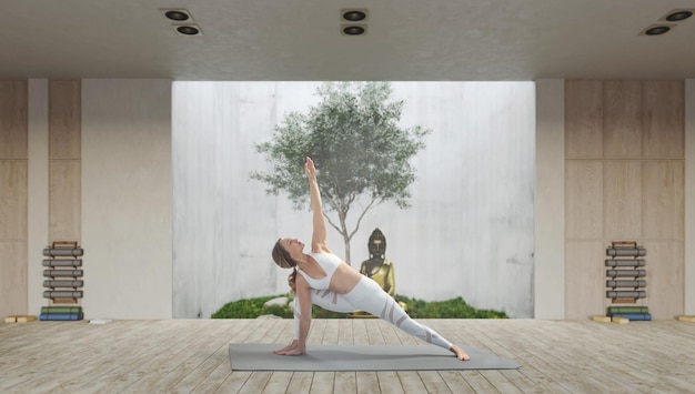 Yoga di pratica della giovane donna attraente atletica
